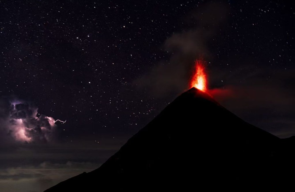 Volcán de Fuego with stars and lightning